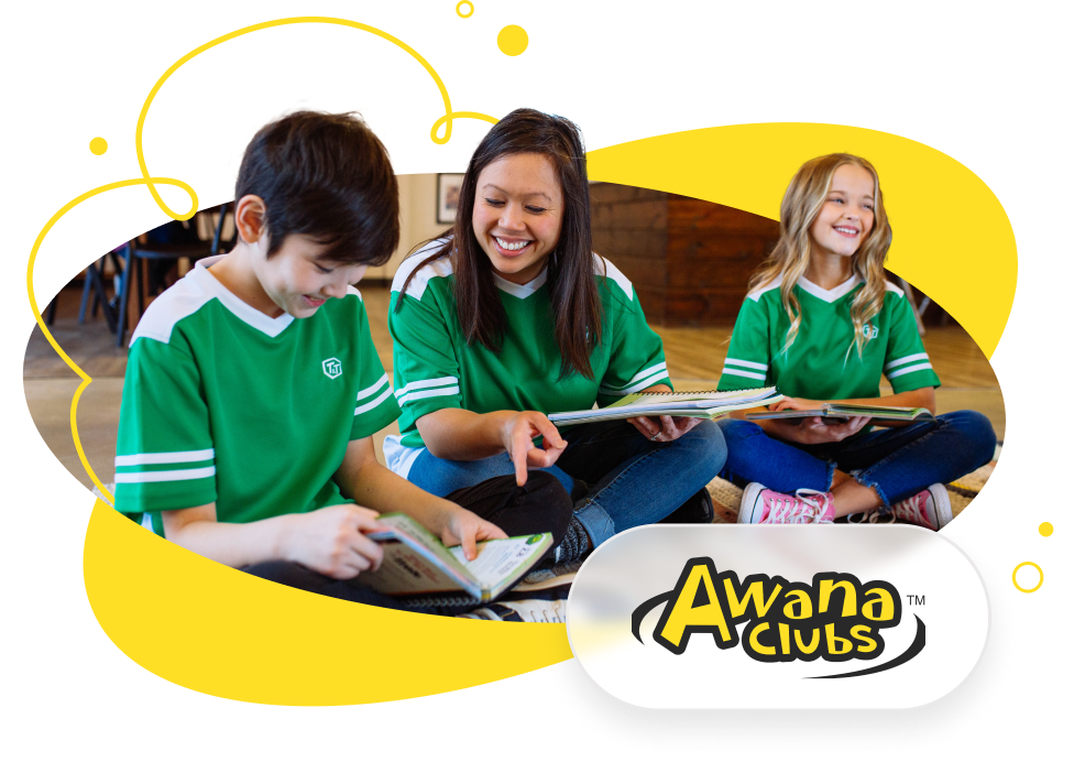 An Awana leader reading with children